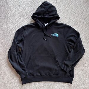 The North Face Men’s Black Hoodie with Light Blue Logo Elk Back Design